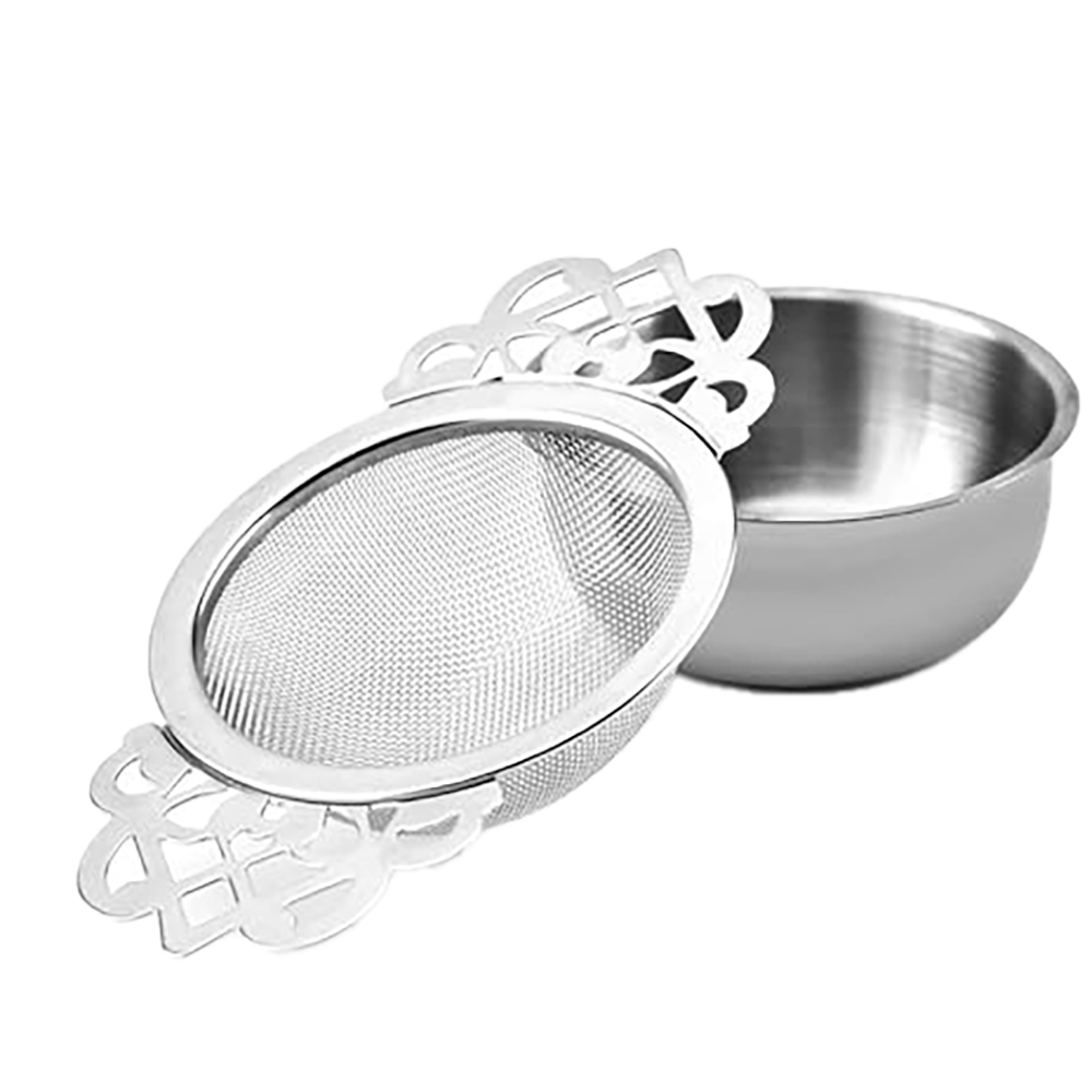 A silver gilded tea strainer with bowl